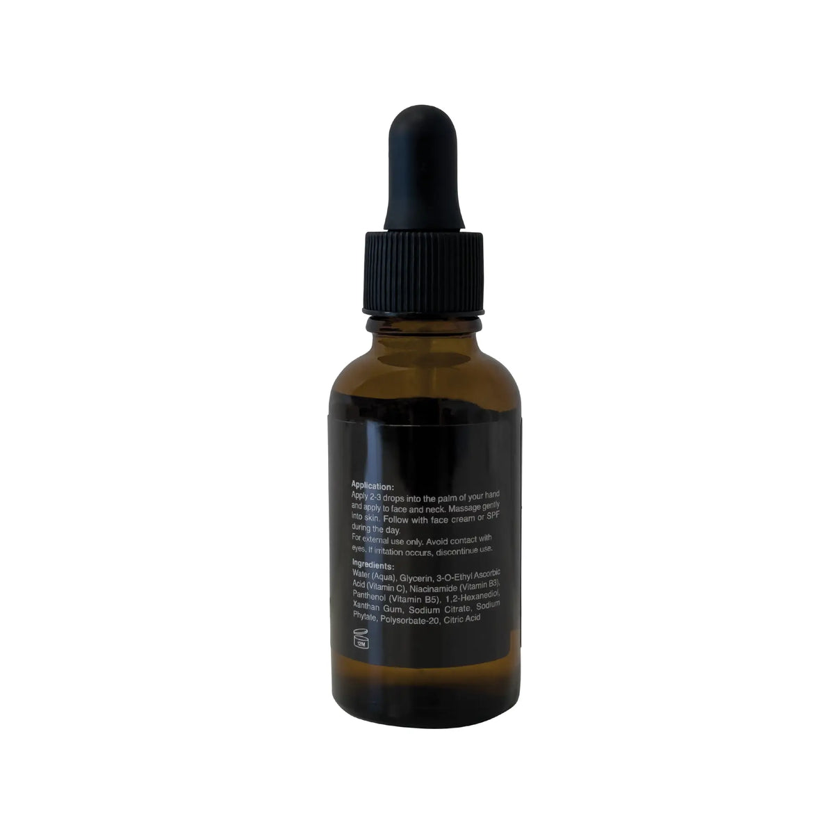 Back of the Even Ground Serum bottle showing application instructions and ingredient list including niacinamide and vitamin C